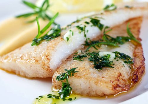 Fillet of white fish with parsley, garlic, olive oil and lemon sauce.